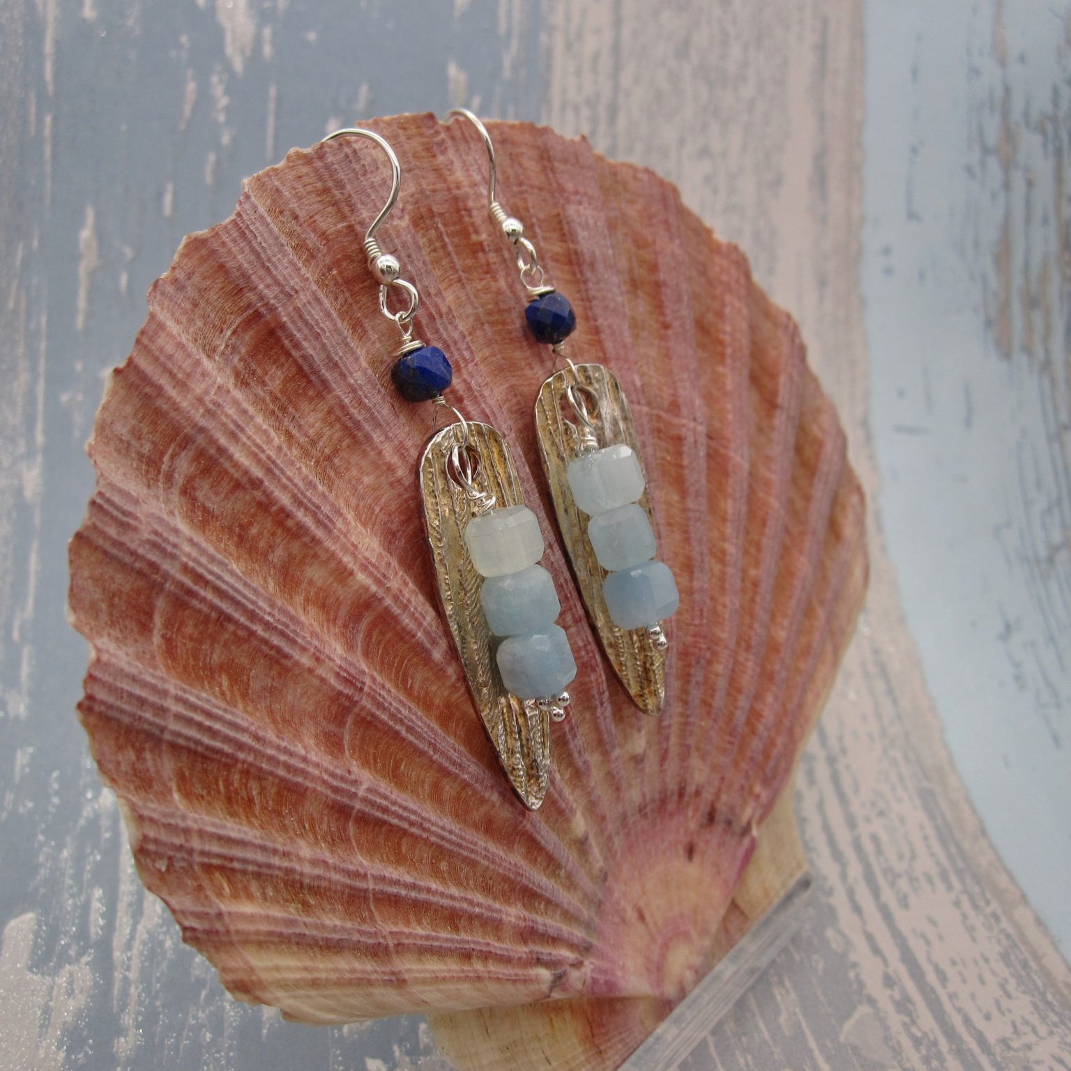 Long drop handcrafted silver earrings with aquamarine and lapis lazuli.