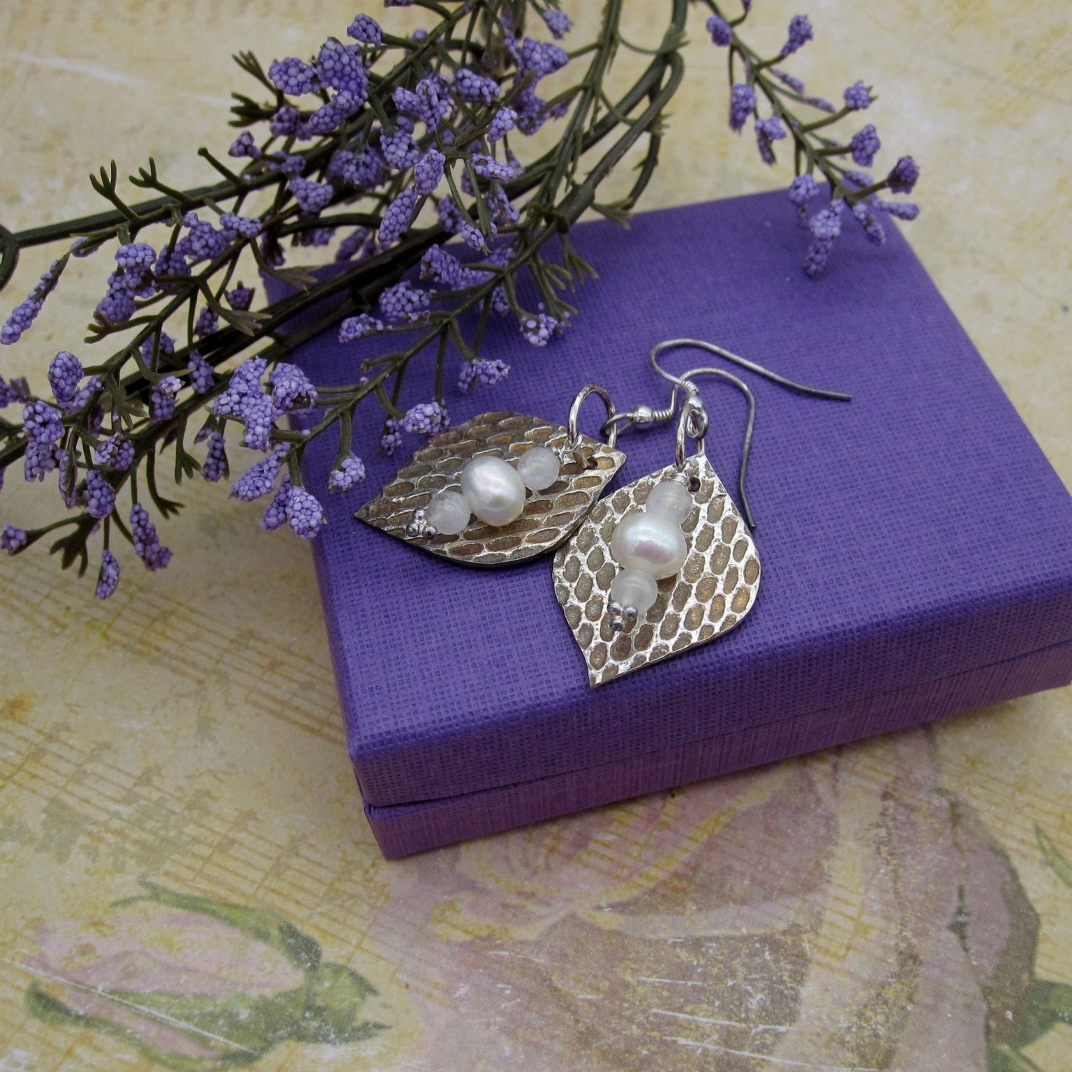 Handcrafted silver earrings with honeycomb texture and pearls