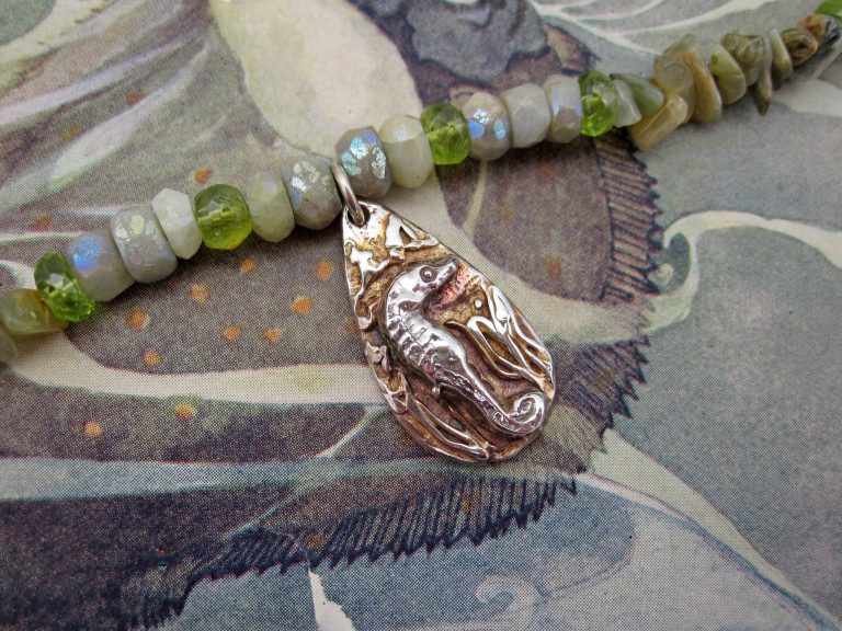 Necklace with handcrafted silver seahorse, aquamarine and peridot